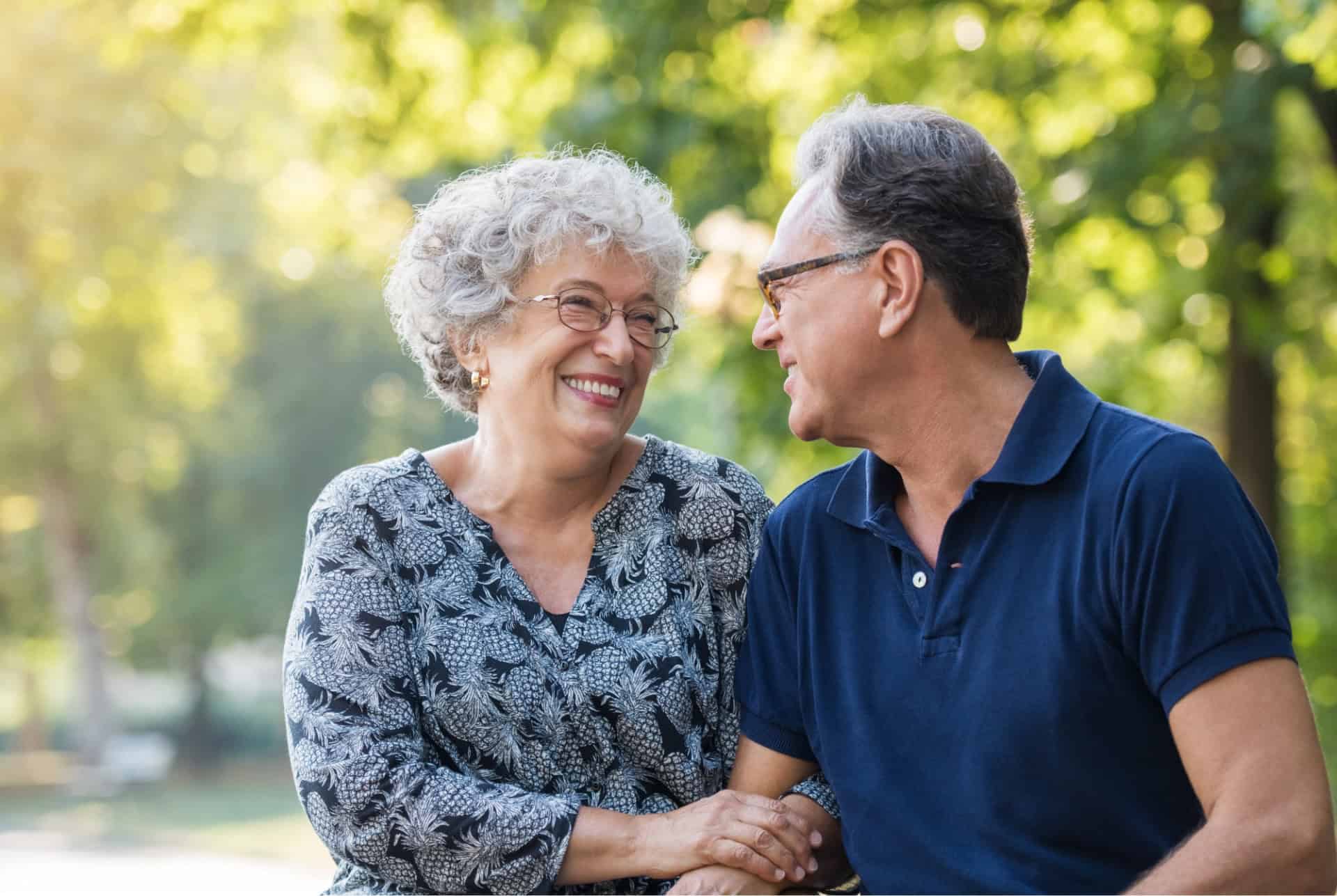 a senior couple learn how to avoid becoming scam victims with Lafayette Federal Credit Union's free event