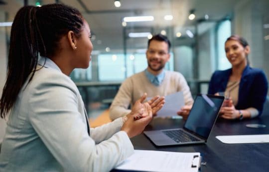 Black businesswoman completing business in work setting