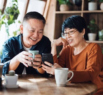 Asian couple enjoying coffee in the greenhouse