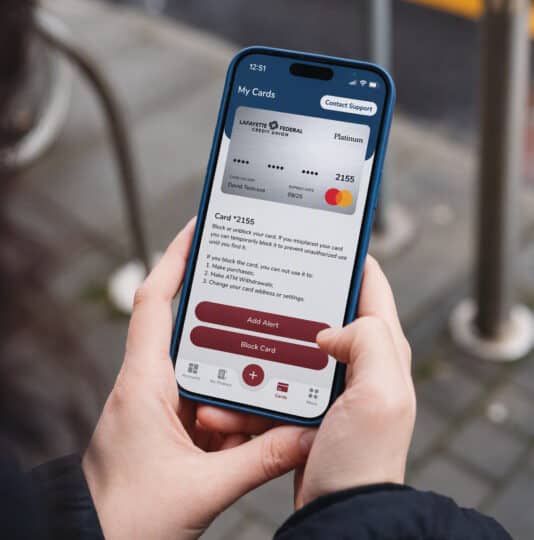 person using a smart phone to access their debit card in mobile banking