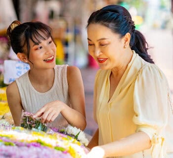 Mother and daughter flower shopping