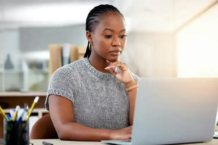 Woman reading on her computer